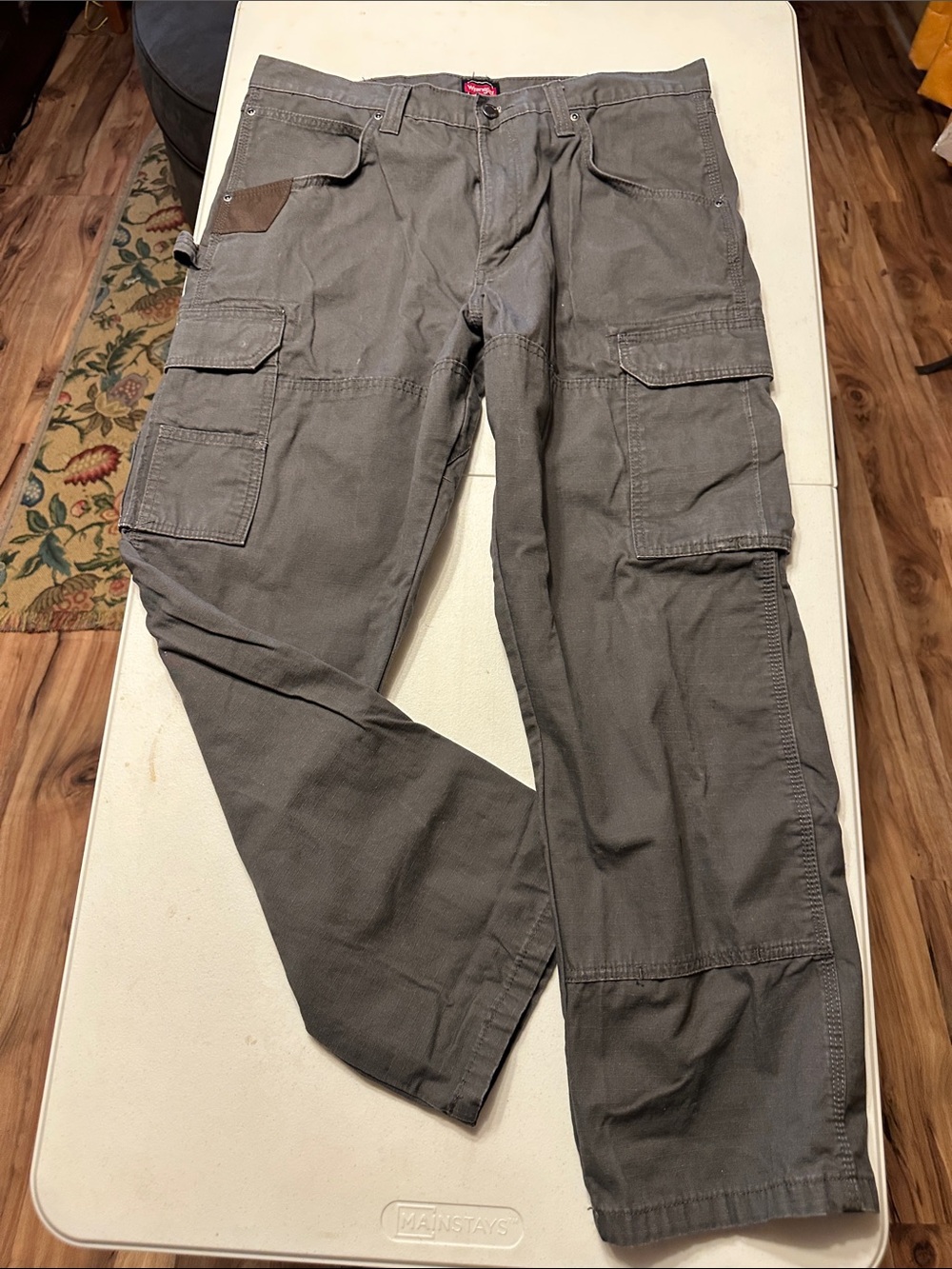Dickies Men's Cargo Pants in Olive have a discolor